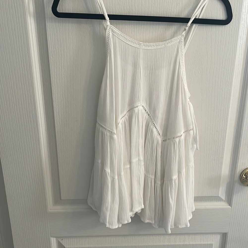 White, sleeveless blouse.